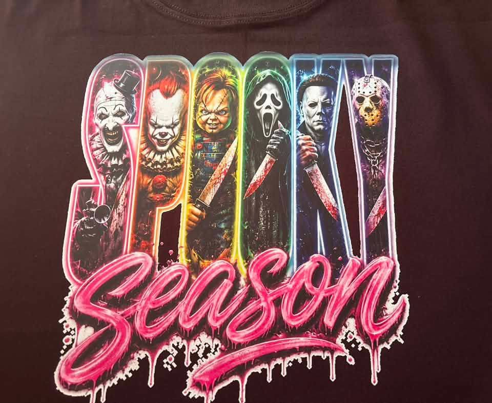 Close-up of Spooky Season design pressed on black fabric